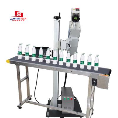 China Laser Marking Fly CO2 Assembly Line Flying Laser Printing Machine Spotting Pet for sale