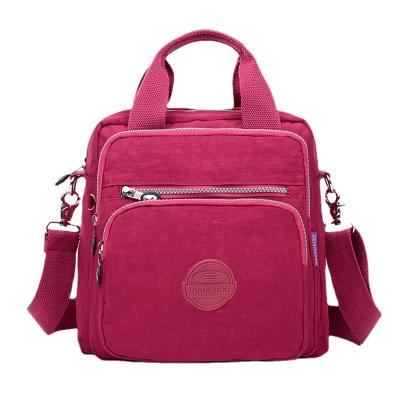 China 2022 Summer New Handbag Luxury Waterproof Korean Nylon Fabric Casual Lightweight Backpack For Women for sale