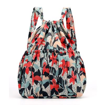 China 2022 New Waterproof Drawstring Women's Backpack Women's Nylon Fabric Backpack Group Pocket Flower Printed Foldable Bag For Women for sale