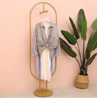 China The store modern personality clothing shelf gold hanging clothes rack women's clothing store hanger display rack for sale