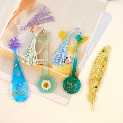 China Europe DIY Crystal Dripping Flower Beautiful Hand Made Feather Musical Instrument Book Mark Epoxy Silicone Resin Mold for sale