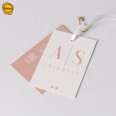 China Pink Custom Barcode Sinicline Logo Hair Extension Packaging Paper Hangtag for sale