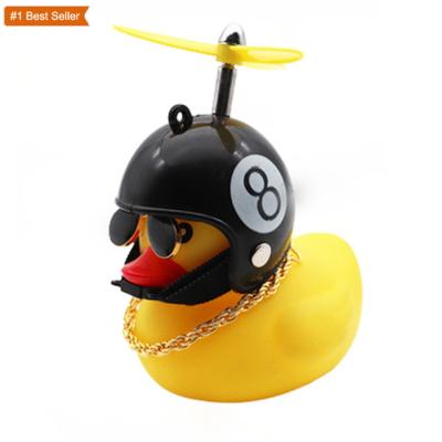 China Water Proof Cute Istaride Small Black Yellow Duck With Helmet Booster Anorak Rubber Duck Squeeze Sound Internal Car Decoration for sale