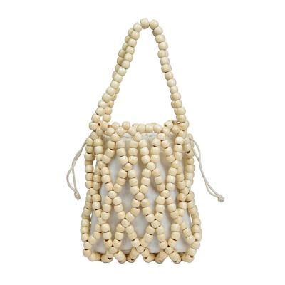 China Best Selling Water Resistant Fashion White Wooden Beads Ladies Hand Held Bag for sale