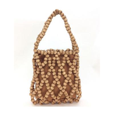 China Water Resistant Fashion Women Bag Dark Brown Wooden Beads Hand Held Bag for sale