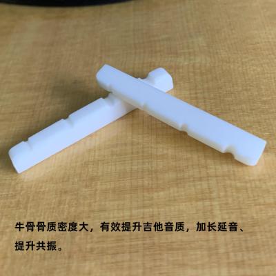 China GUITAR COW BONE 4 String Electric Bass Guitar Nut for sale