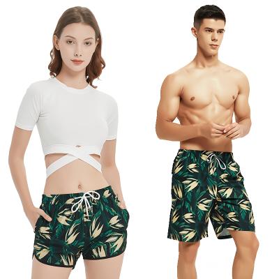 China Couples Swimwear Breathable Custom Fly With Elastic Waistband Side Pockets Beach Panel Trunks Surfing Swimming Shorts For Women Men for sale