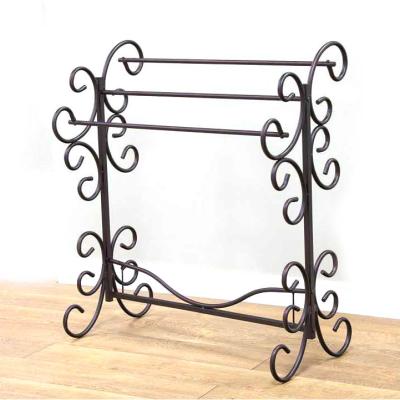 China Free Standing Coat Art Clothes Display Rack Popular Pattern Extendable Black Bathroom Metal Clothing Shelf Metal Rack for sale