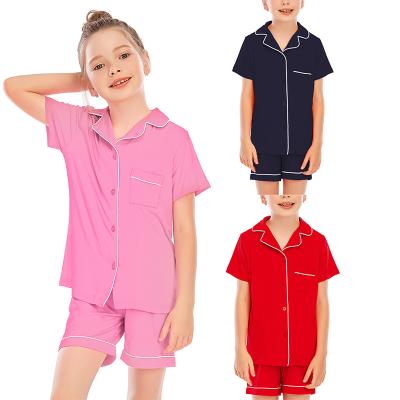 China Pure QUICK DRY Boys Girls Solid Color Summer Pajamas Modal Pajamas Sets Short Sleeve Front Button Sleepwear For Children for sale