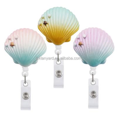 China Retractable ID Card Badge Holder 360 Gradient Effect Resin With Conch Badge Reel Holder Yoyo Badge Reel Holder Doctor Nurse Student ID Chain Card for sale