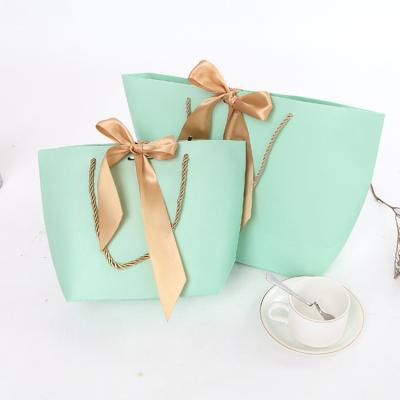 China High Quality Materials Hot Sale Purse Gift Bag Recycled Paper Paper With Bow Knot Envelope Shopping Gift Bag for sale