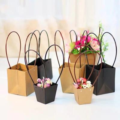 China Elegant Recycled Materials Custom Decorate Kraft Paper Gift Bag With Handle For Flower for sale