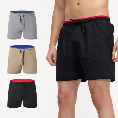 China Newcomers QUICK DRY Zipper Pockets Gym Color Blocked Mens Shorts for sale