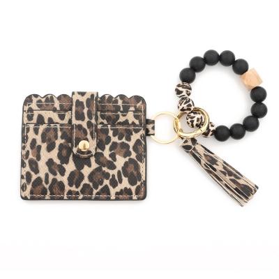 China Free Shipping Fashion PU Leather Silicone Beads Leopard Wristband Key Ring ID Card Holder For Casual for sale