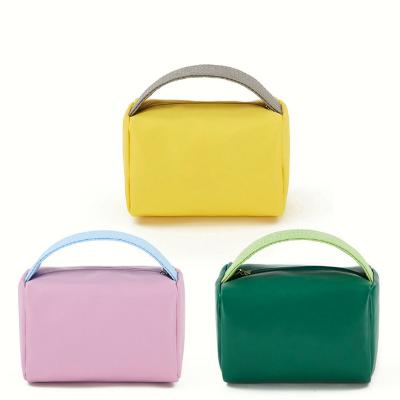 China 2022 New Fashion Storage Stuff Creative Portable Place Candy Waterproof PU Tote Cosmetic Bag For Girls Large Capacity for sale