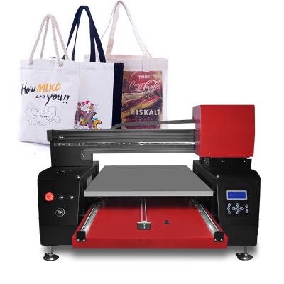 China Cotton T-shirts Bottle Flatbed Printer 60*90 Size Printing Machine DTG UV Industrial Inkjet Printer For Phone Case for sale