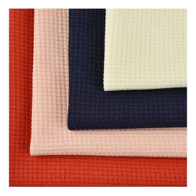 China Textile manufacturers 40S Anti pilling solid colors 100% polyester cotton like waffle fabric for home wear zu verkaufen