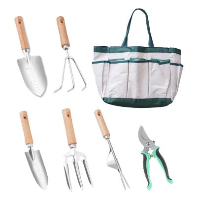 China Stainless Steel Garden Tool Kit 7 Piece Stainless Steel DIY Tools Starter Kit With Garden Bag Wooden Handle Custom Logo for sale