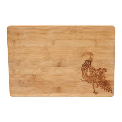 China Traditional Wooden Chopper Block Cutting Wooden Kitchen Bamboo Cutting Board With Laser Pattern for sale