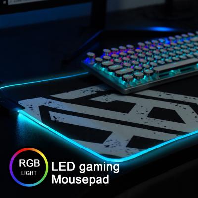 China Custom High Quality RGB Light Waterproof Multifunctional Luxury Large Logo Leather RGB Mouse Pad For Gaming for sale