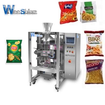 China Food Aluminum Electric Automatic Large Pellet Vertical Packing Machine For Candy Nut Sealing Weighing With Vacuum Pouch Bagging for sale