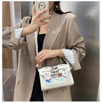 China Daily Lifestyle Niche Color Graffiti Cross - The New Body Bag Shoulder Bag For Women's Ins Fashionable Women's Bag for sale