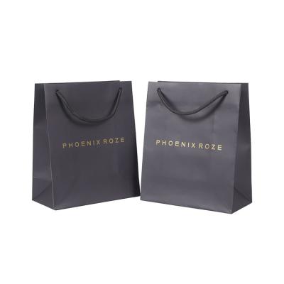 China Recyclable high quality paper apparel packaging store paper bag special custom made paper bags for clothing packaging for sale