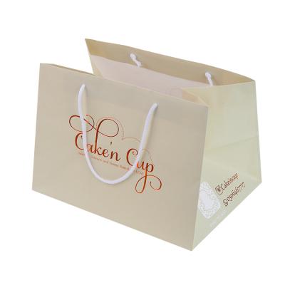 China Customization logo coated paper recyclable cake take away clothing paper bags luxury large paper bag for sale