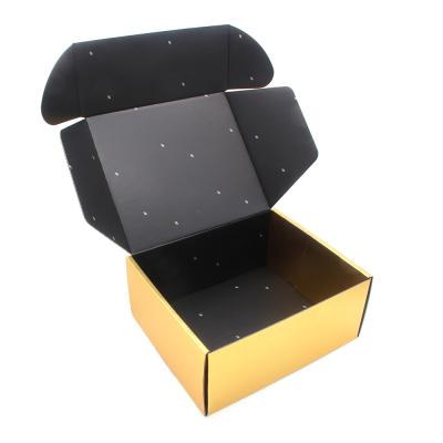 China El negro de impresión de encargo de la cartulina acanalada y la caja de envío del oro subieron las cajas del oro que empaquetaban con el logotipo en venta