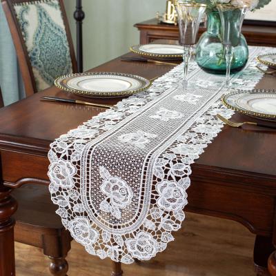 China Waterproof Custom Low Hollow Out Design Table Flag Hotel Wedding Banquet Rectangular High End Embroidered Table Cloth for sale