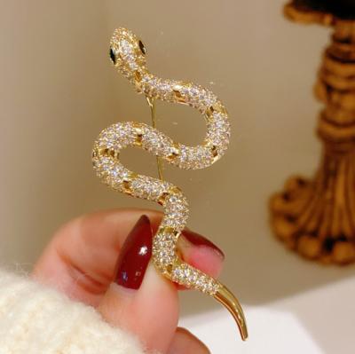 China Metal Maxery Exquisite Cubic Zircon Snake Brooch White Gold Charm Dress Brooch Pin For Women's Party for sale