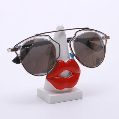 China New Desktop Creative Ornament Acrylic Lips Glass Resin Lips Glass Shelf Display Stand Maxery Fashion Gift Holder Sunglasses for sale