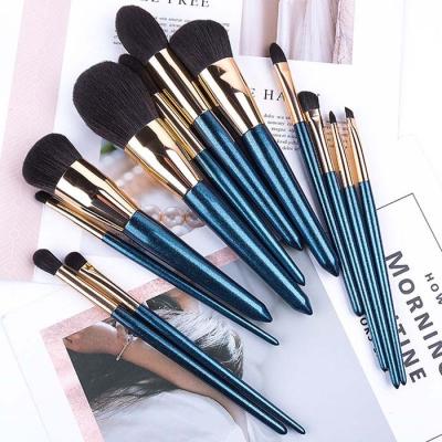 China Angular Blush Blue Shimmer Powder Brush Concealer Concealer Brush Makeup Brush Gemstone 12pcs Handle Gold Wood Brass Olive Blue Shimmer Flat Brush for sale