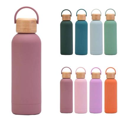 China Business 500ml 750ml Lid Stainless Steel Rubber Polished Bamboo Insulated Thermal Water Bottle With Stand for sale