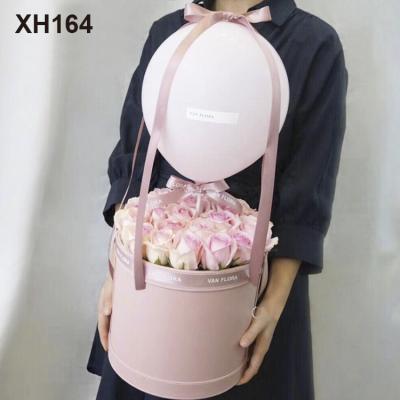 China Handmade Portable Leather Bucket Flower Embrace Round Flower Packaging Box Bouquet Gift Box for sale