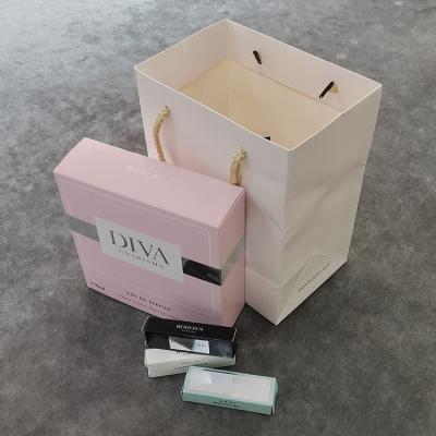 China Factory Price Skin Care Cosmetics Handmade Card Foldable Foiled Gift Box With Handbag for sale