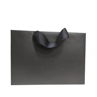 China Luxury Brand Recyclable Custom Printed Retail Packaging Black Paper Bag With Logo for sale