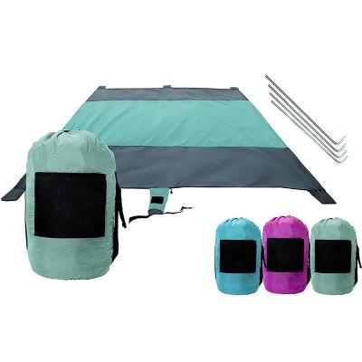 China Hot Selling Sandproof Amazon Parachute Blanket 7x9 Ft Foldable Nylon Beach Mat With Sand Pocket for sale