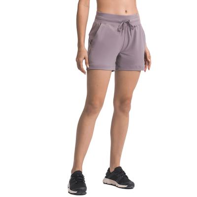 China Breathable Wholesale Stretch High Waist Running With Side Pockets Adjustable Drawstring Sports Shorts for sale