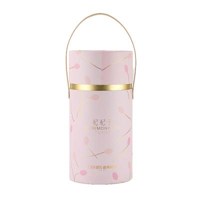 China Corrugated Board Custom Paper Cylinder Box With Handle For Cosmetic Products Packaging for sale