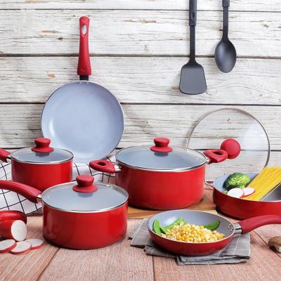 China Sustainable 12pcs Pressed Aluminum Ceramic Coated Cooking Pots And Pans Red Cookware Set With Glass Lids And Nylon Utensils for sale