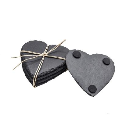 China Amazon Viable Top Selling Drink Coasters 4 Inch Natural Edge Heart Shaped Slate Black Stone Coaster For Cups And Mugs for sale