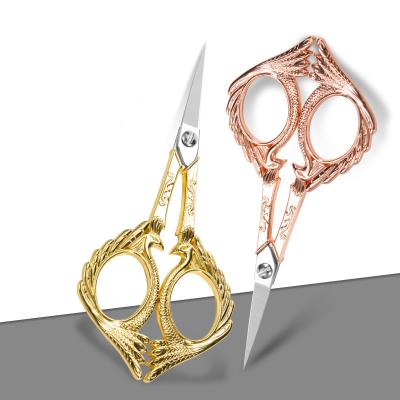 China Universal Cut Retro Winged Phoenix Scissors Gold Rose Gold Beauty Scissors Stainless Steel Zinc Alloy Adjustable Scissors for sale