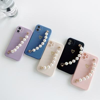 China High Quality Cavity Love Anti-drop Cell Phone Case Pearl Laser Soft Silicone For iPhone 11 12 Pro Max Case Love Chain Wrist Band for sale