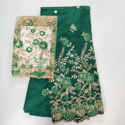 China Sustainable Nigerian Wholesale Dress Green Color George Totes Dress With French Lace Blouse African George Silk Fabric for sale