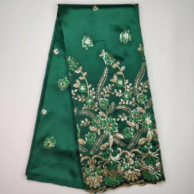 China Sustainable New Fashion Green African Georges Lace Fabrics With Sequins India Georges Silk Wrappers for sale