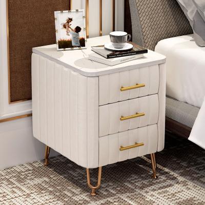 China Italian new design style light luxury stainless steel fabric simple modern golden bedside table for sale