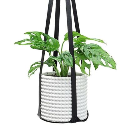 China Traditional Hanging Planter Baskets Flowerpot Plant Holder Macrame Plant Hanger Garden Leather Plant Hanger for sale