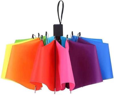 China Colorful Rainbow Design 3 Folding Manual Umbrella with Windproof and Metal Fiberglass Ribs for sale