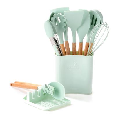 China Stocked 12pack Best Selling Kitchen Accessories Tool Kit Wooden Handle Kitchen Tableware Silicone Cookware Sets for sale